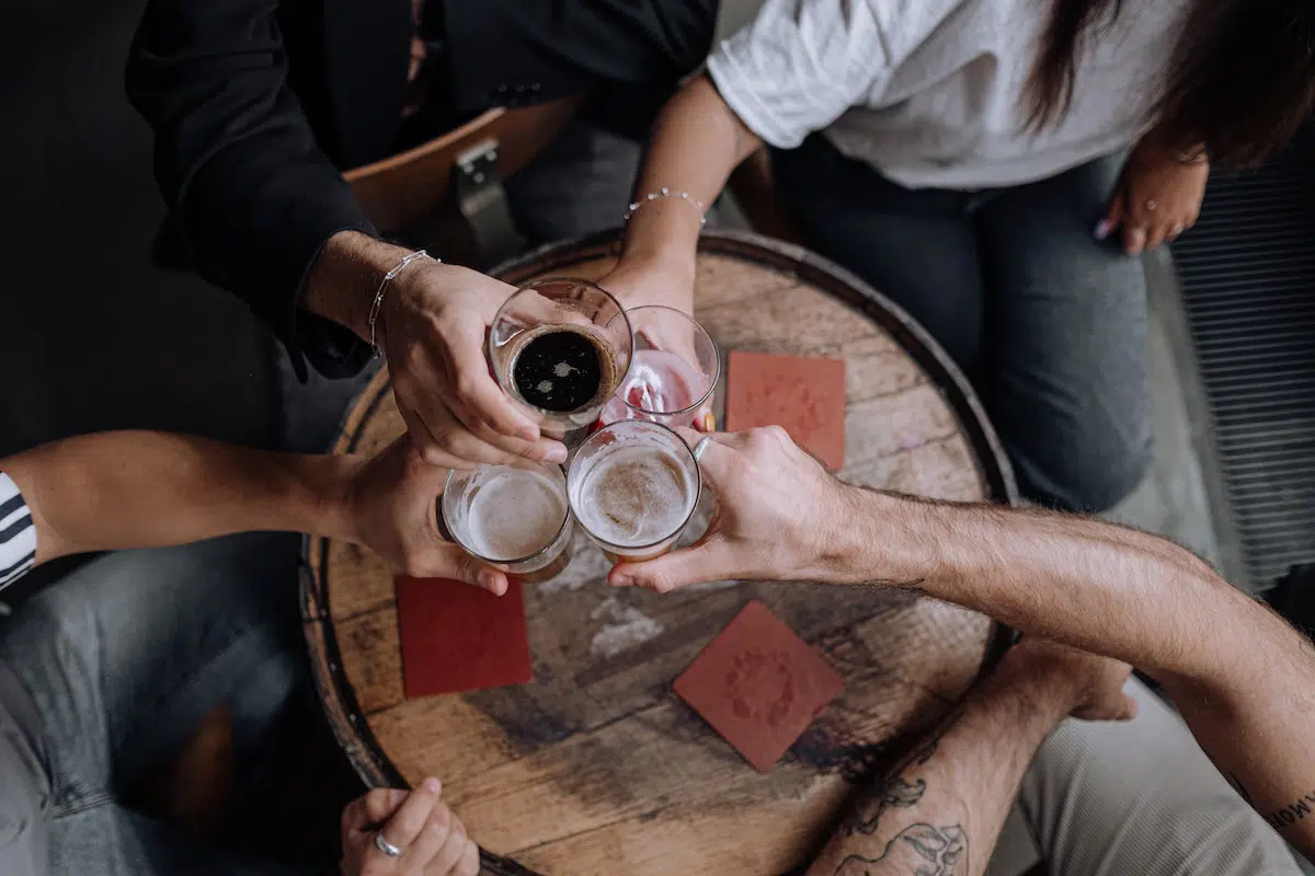 Group of people drinking beer at a Missouri dram shop