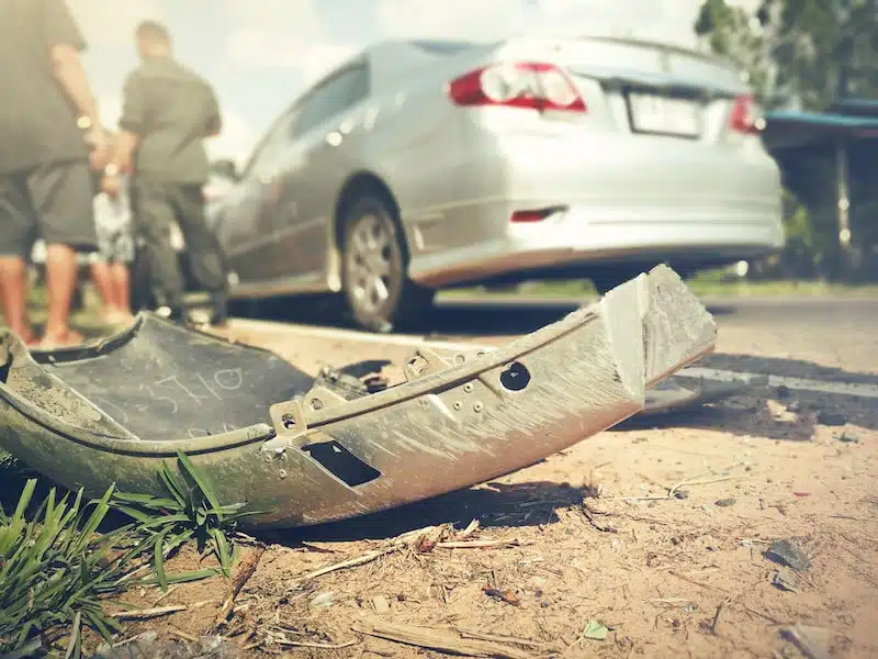 Part Of A Car Broken Off Laying On The Road