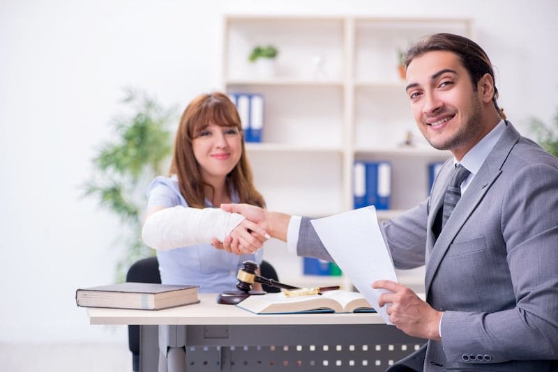 Personal Injury Lawyer Shaking Hands With His Client